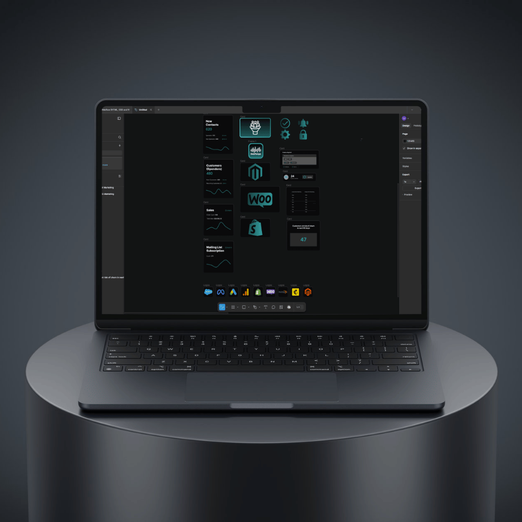 Modern laptop displaying various app icons and data analytics interface on a sleek black surface.