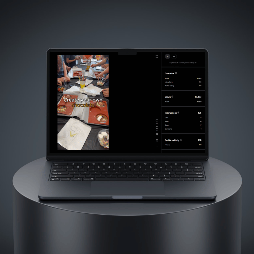 Laptop displaying a chocolate-making tutorial with interactive statistics and user engagement features.