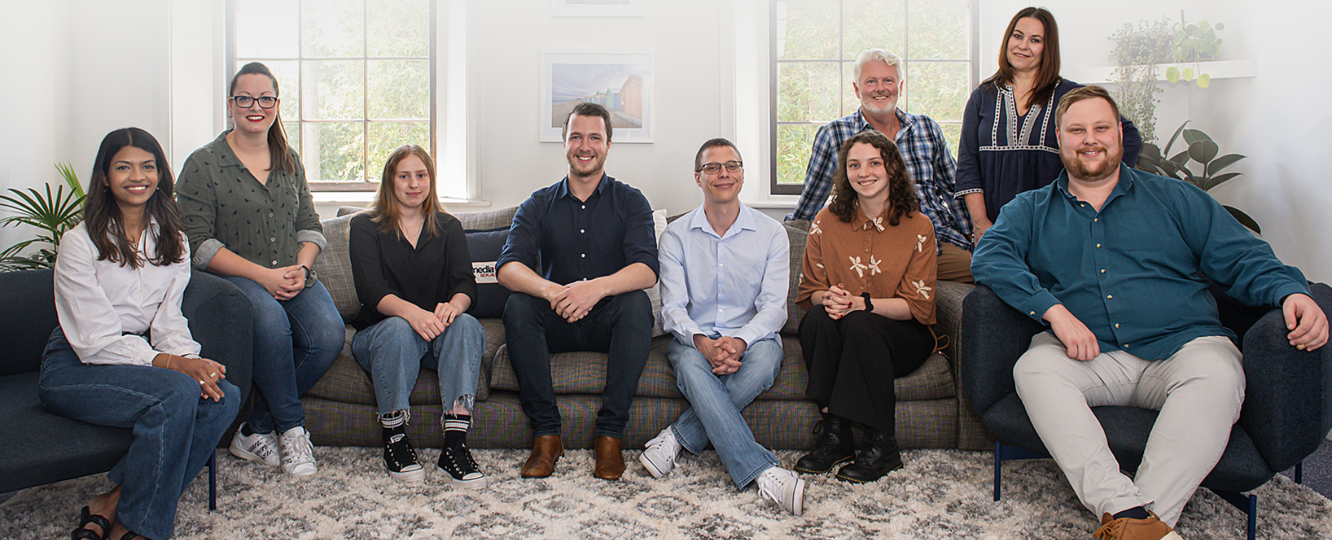 DataTempo team photo at office table